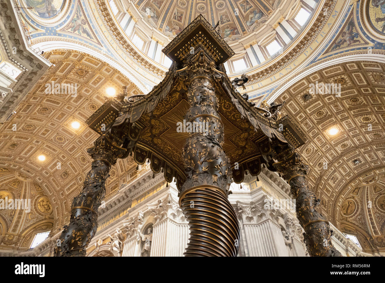 The altar with Bernini's baldacchino, St. Peter's Basilica, San Pietro in Vaticano, Papal Basilica of St. Peter in the Vatican, Rome, Italy Stock Photo