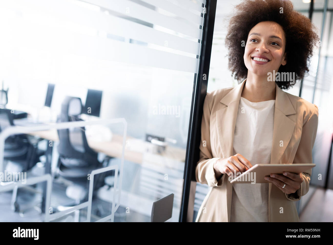 Portrait of a happy young african business woman smiling Stock Photo