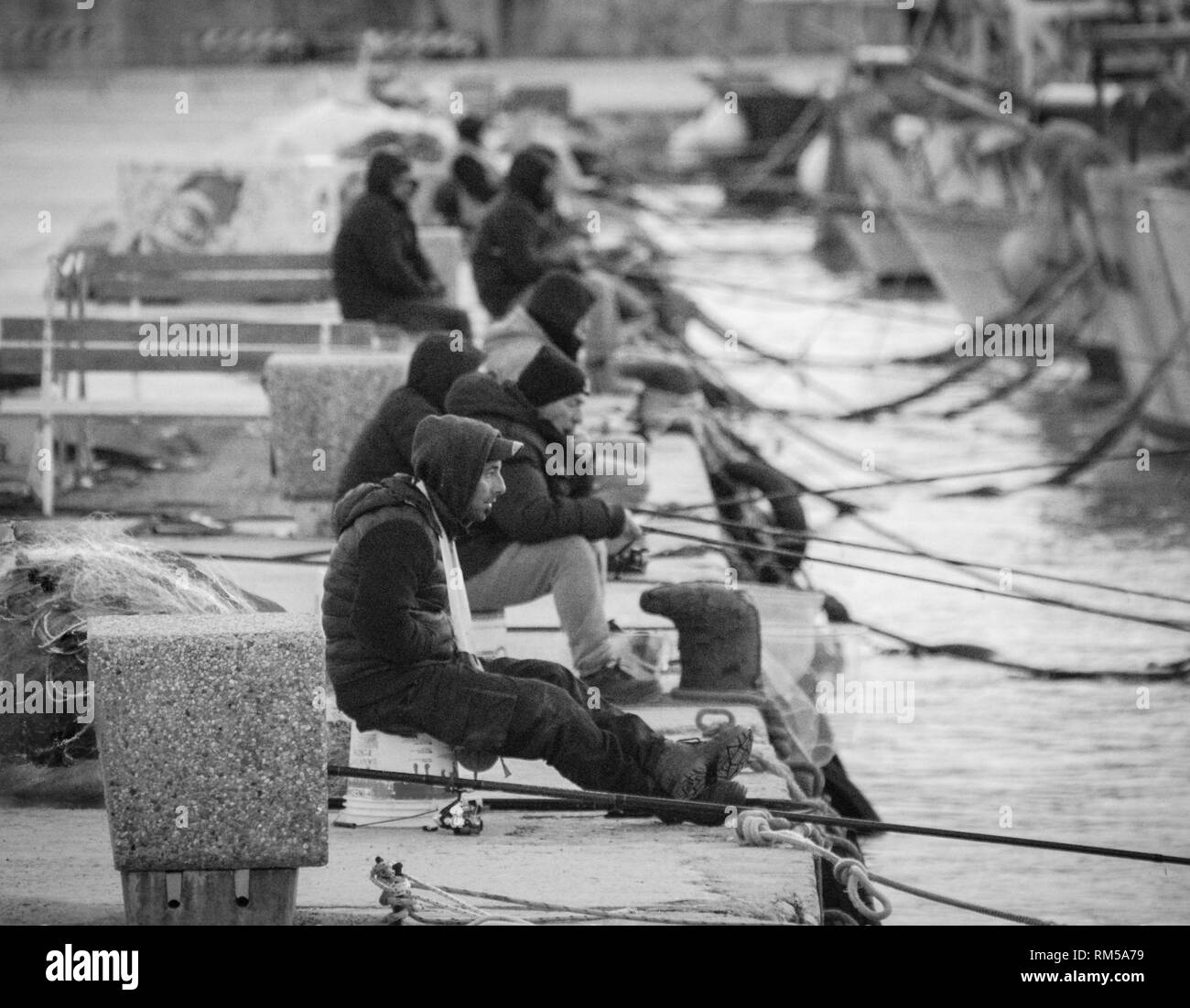 old unemployed man fishing Stock Photo