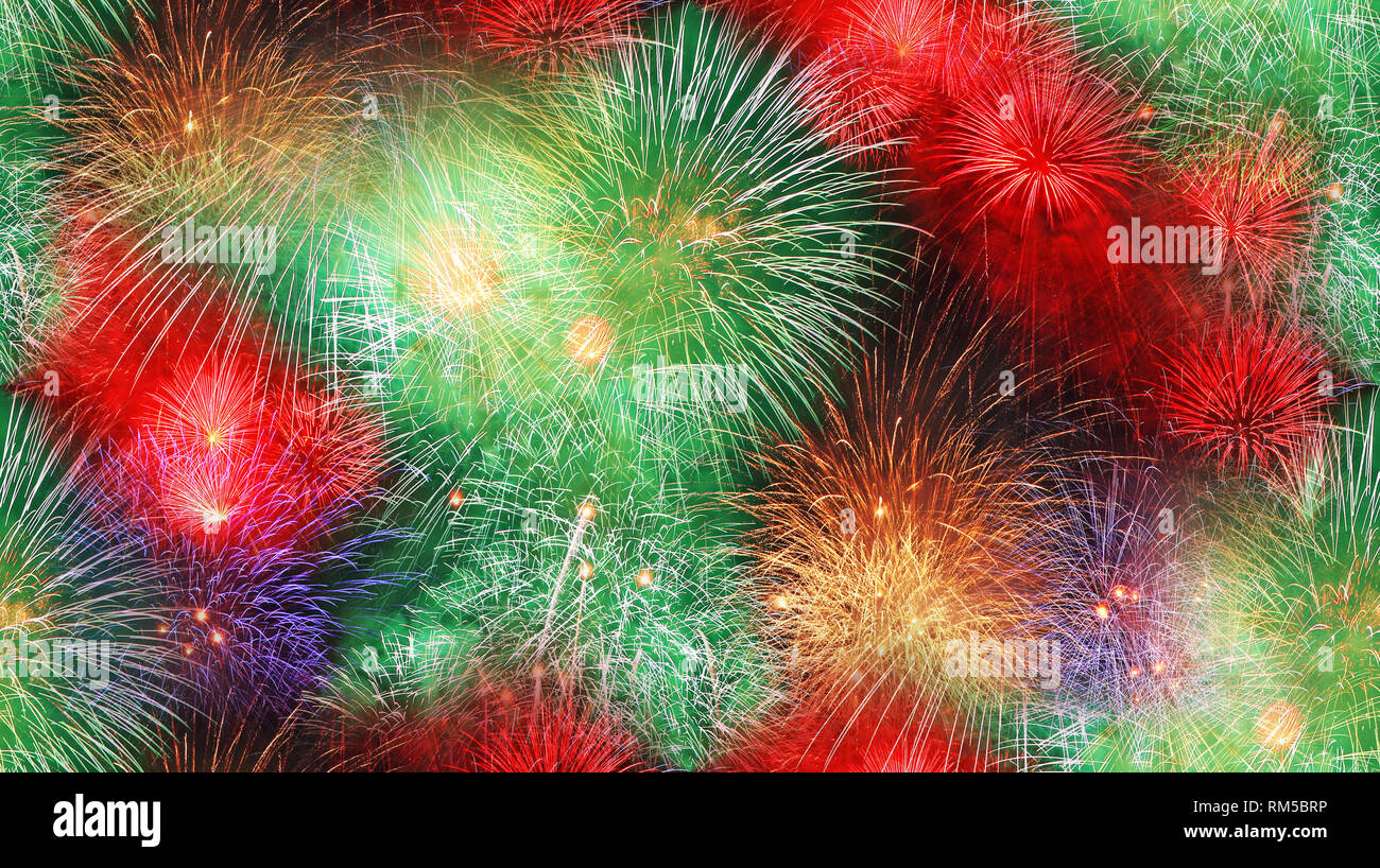 Big fireworks in the night summer sky as a seamless background Stock Photo