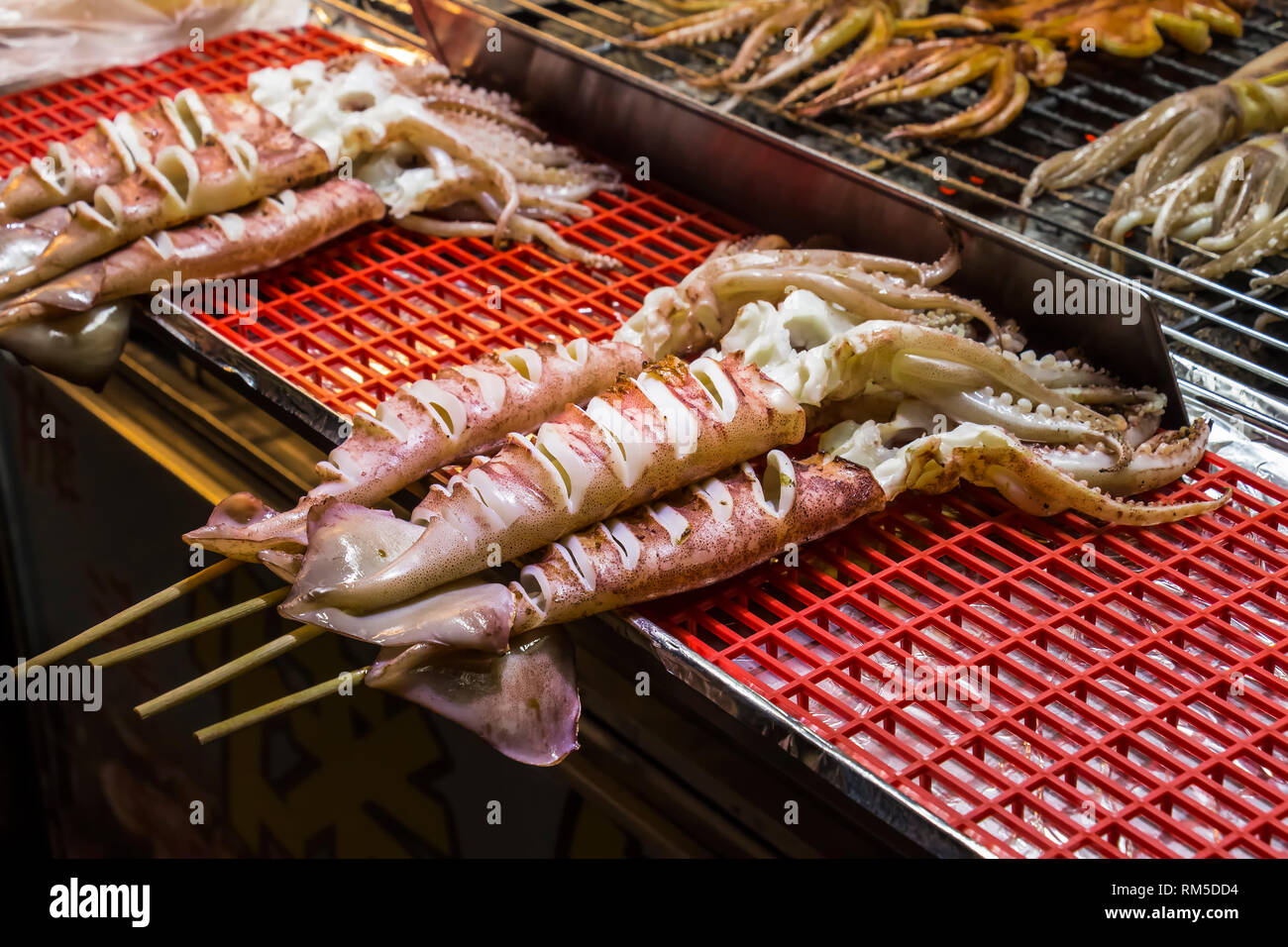 photo Grilled Squid On A Stick https www alamy com fresh whole squid on stick ready for barbecue image236148224 html