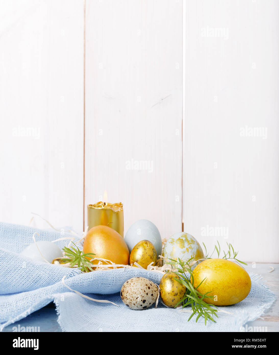 Easter background with Easter eggs and spring flowers. Top view with ...