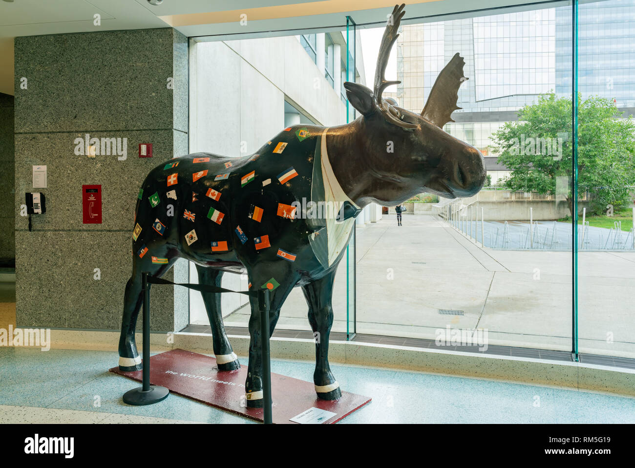 Toronto, SEP 29: Elk statue with many country flags inside the Metro Toronto Convention Centre on SEP 29, 2018 at Toronto, Canada Stock Photo