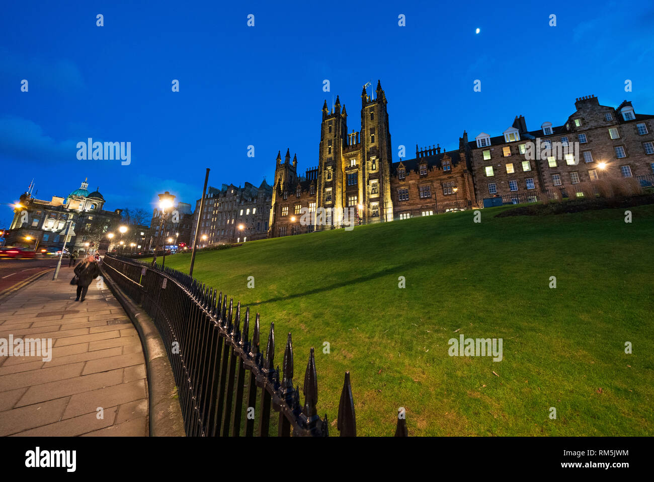 Night view of Edinburgh University New College building on The Mound in Edinburgh Old Town, Scotland, UK Stock Photo