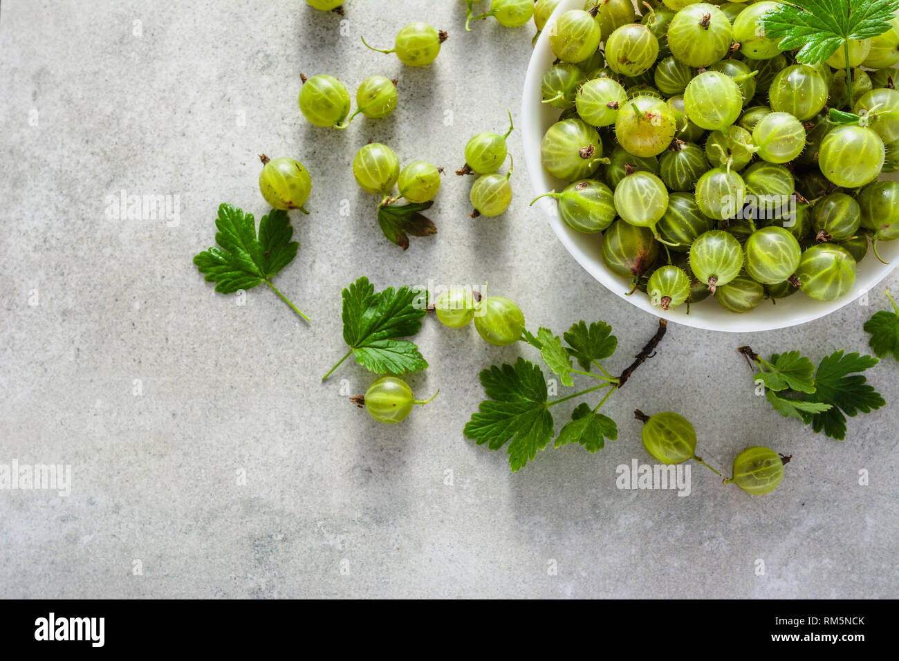 Fresh green gooseberry fruits in a bowl, top view Stock Photo Alamy