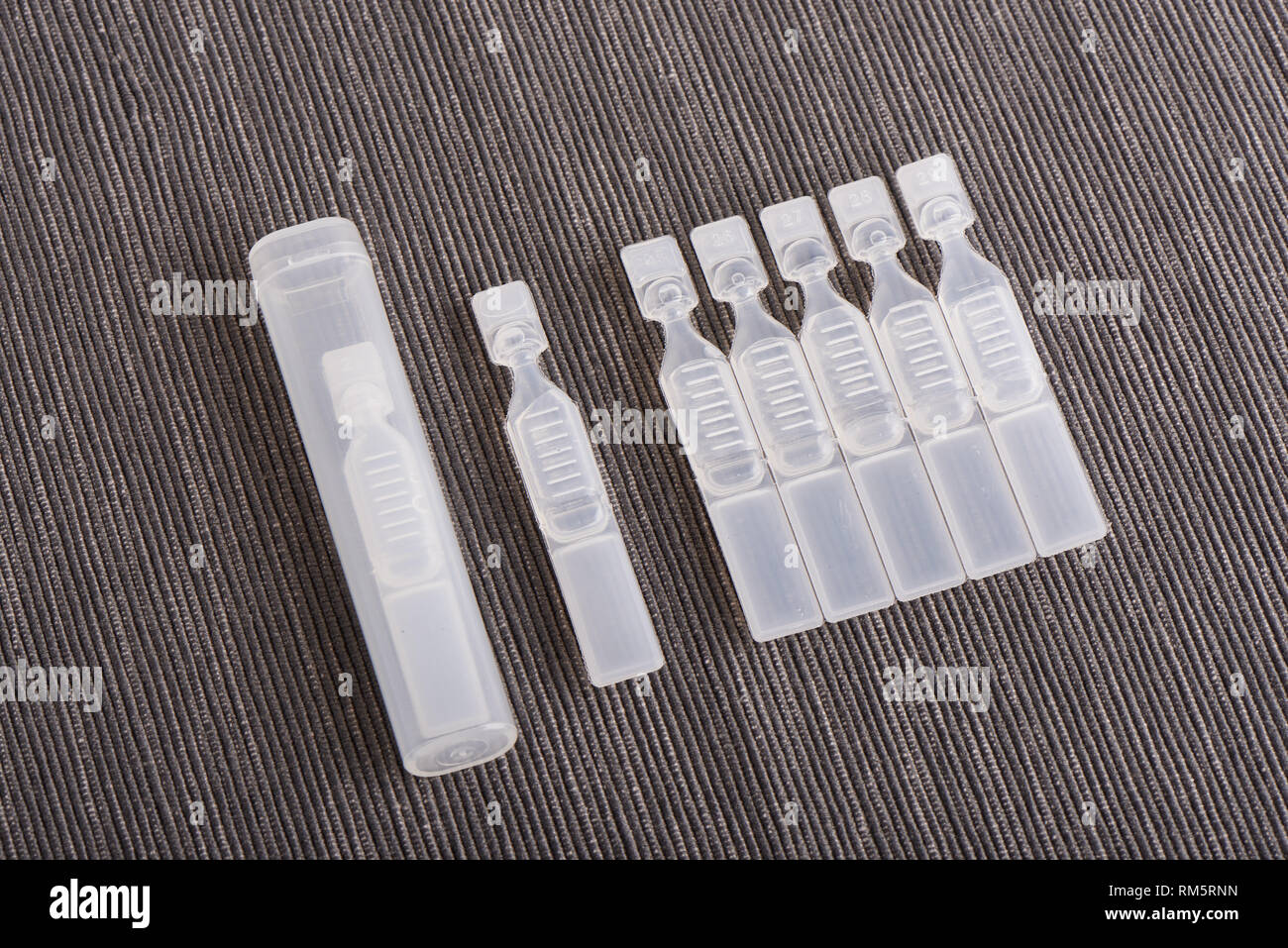 single use artificial tear lubricant eye drops containers with case Stock Photo
