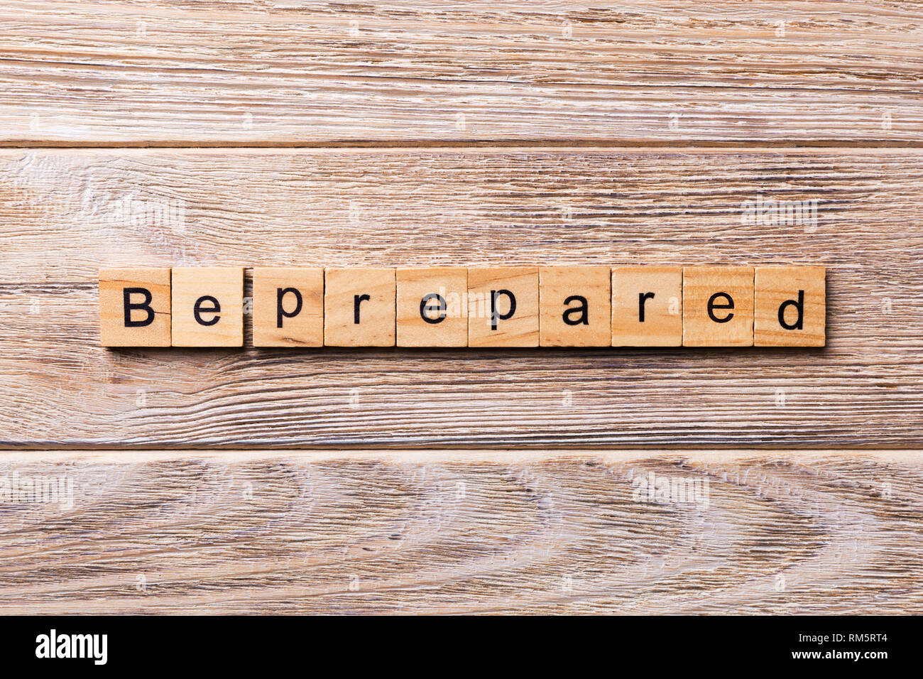 BE PREPARED word written on wood block. BE PREPARED text on wooden ...