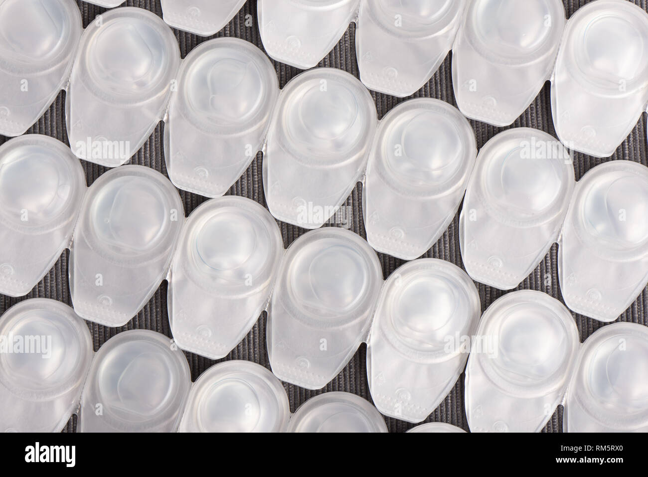 bottom side of oneday contact lenses arranged in lines Stock Photo