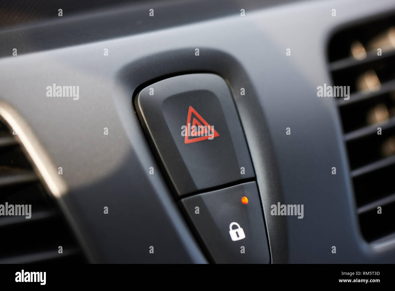 hazard warning light button for warning other drivers that the vehicle is a temporary obstruction Stock Photo