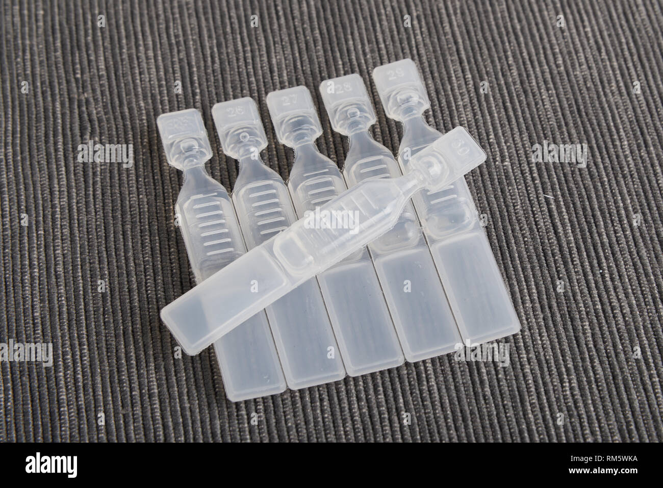 single use artificial tear lubricant eye drops containers Stock Photo