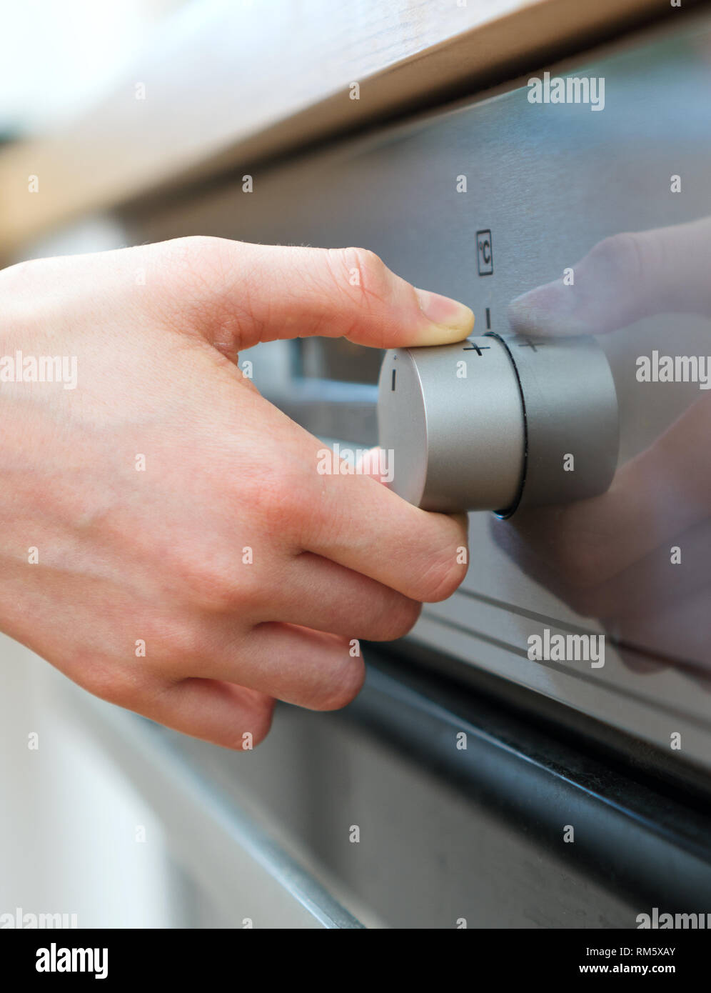 Dangerous situation in the kitchen. Child playing with electric oven