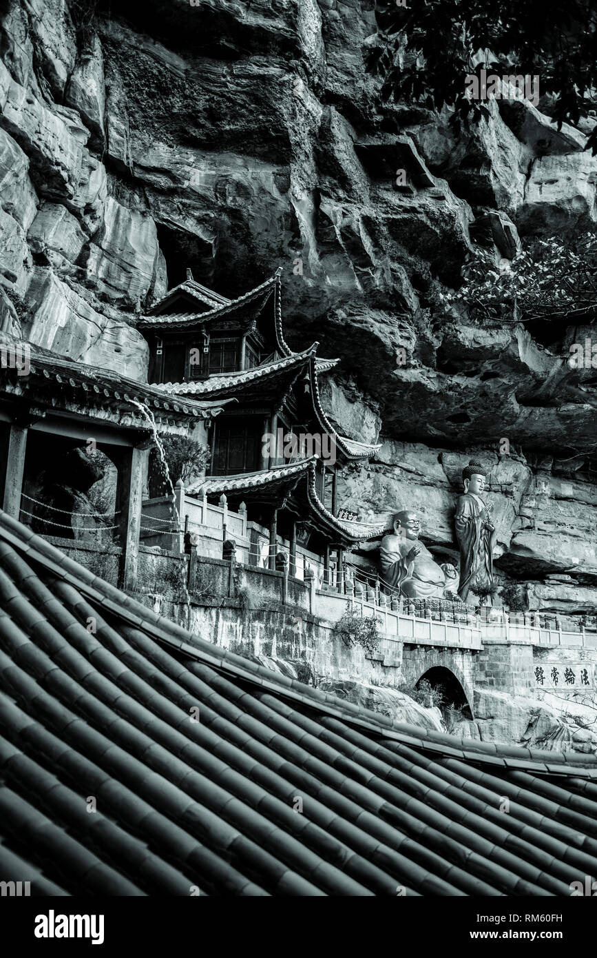 Baoxiang Temple, (also known as Monkey Temple) is an ancient Buddhist temple built on a cliff, Shibao Mountain (Shibaoshan), Yunnan province, China Stock Photo