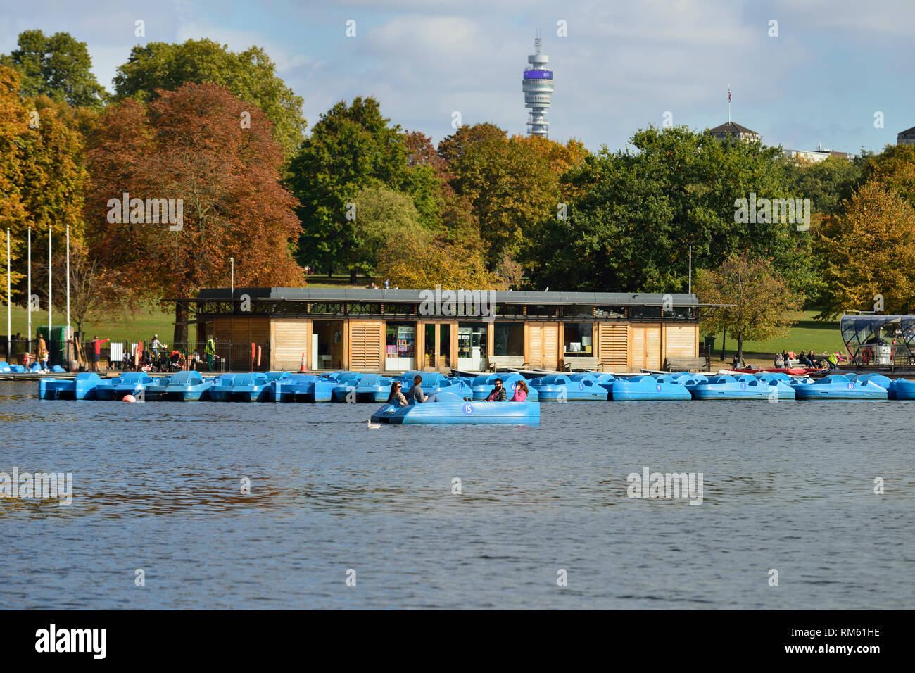 Blue leisure boats or Pedalos on the Serpentine lake, Hyde Park, London