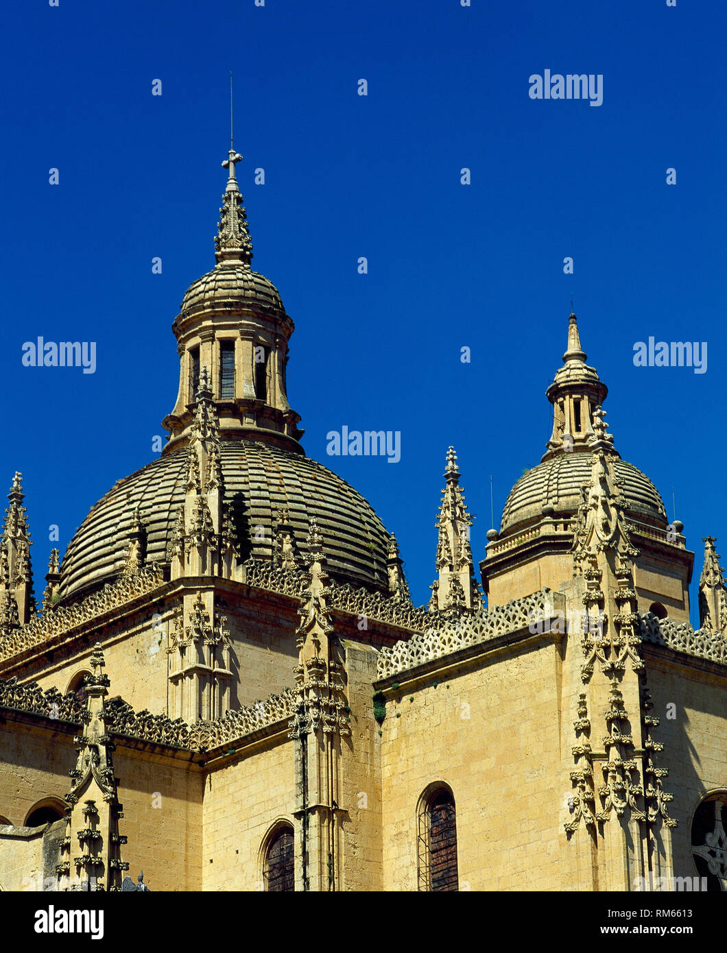 Spain, Castile and Leon, Segovia. Cathedral, dedicated to the Virgin Mary, built in Last Gothic style. 16th century. It was designed by Juan Gil de Hontañon and Rodrigo Gil de Hontañon. Architectural detail. Pinnacles and buttres. Dome and lantern. Stock Photo