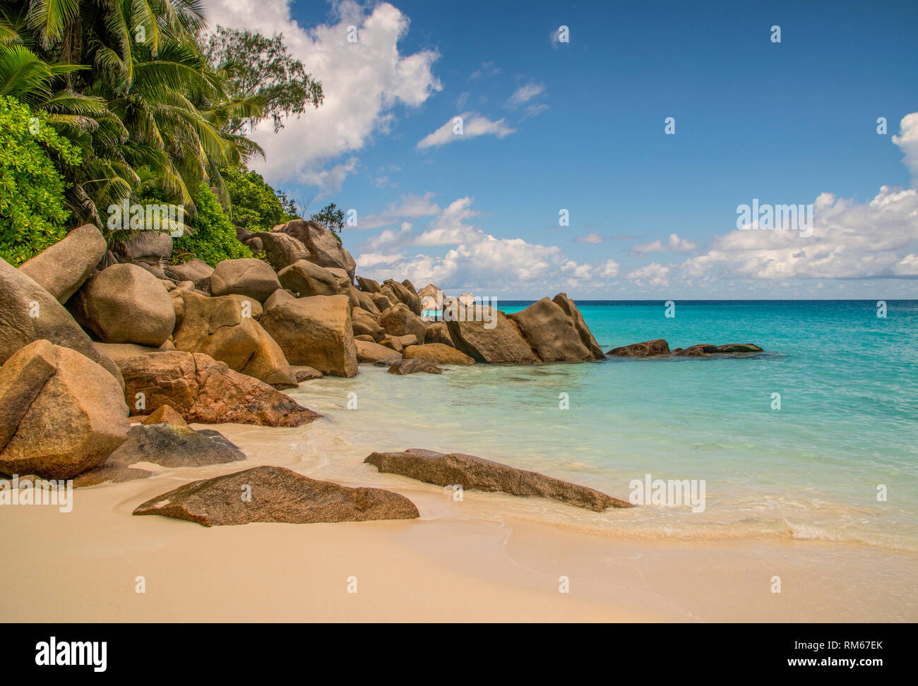 Eroded granite. The action of waves over countless millennia has shaped the hard granite into these sculpted formations. This is the tropical island o Stock Photo