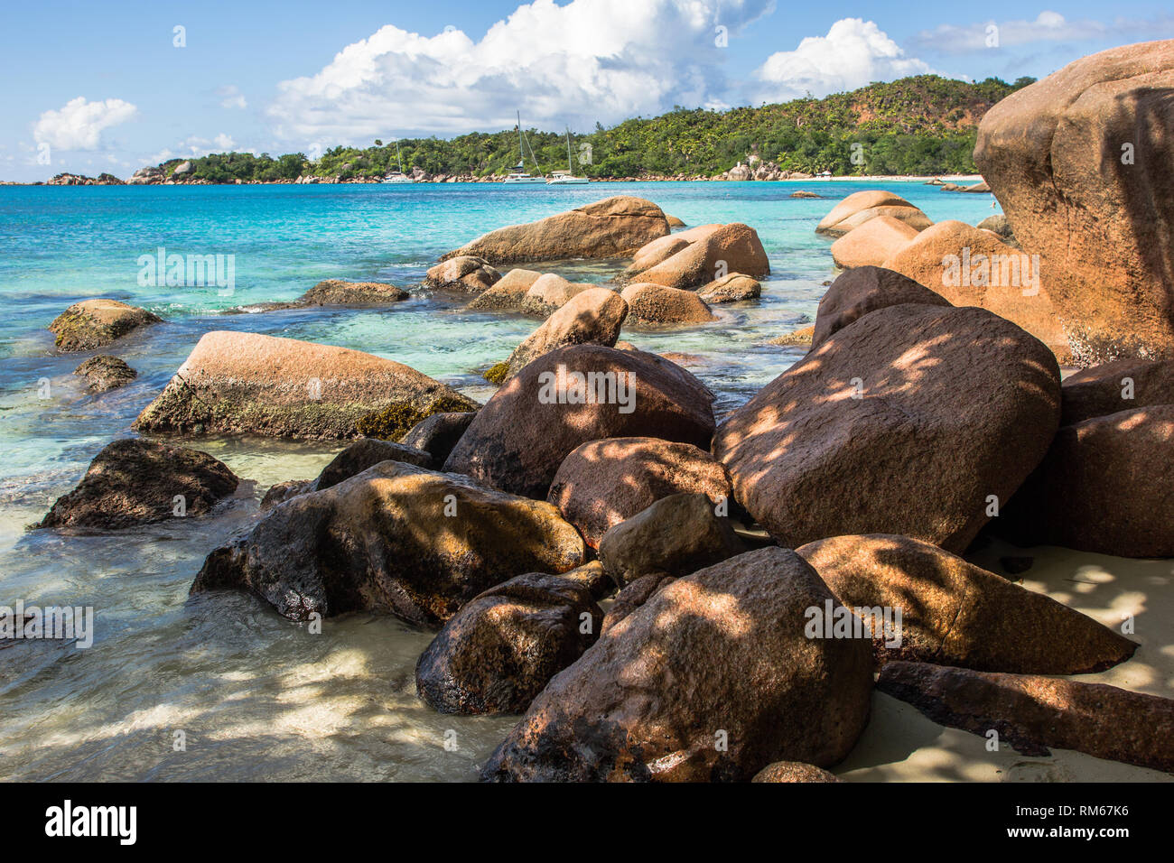 Eroded granite. The action of waves over countless millennia has shaped the hard granite into these sculpted formations. This is the tropical island o Stock Photo