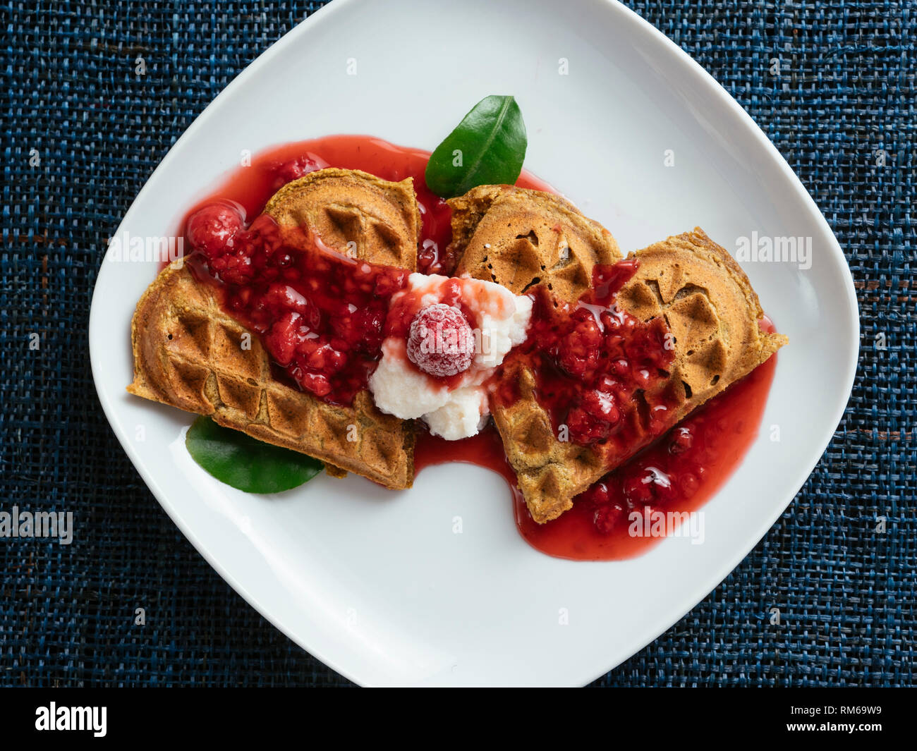 Heart Shaped Vegan Beet Waffles With A Raspberry Sauce Stock Photo Alamy