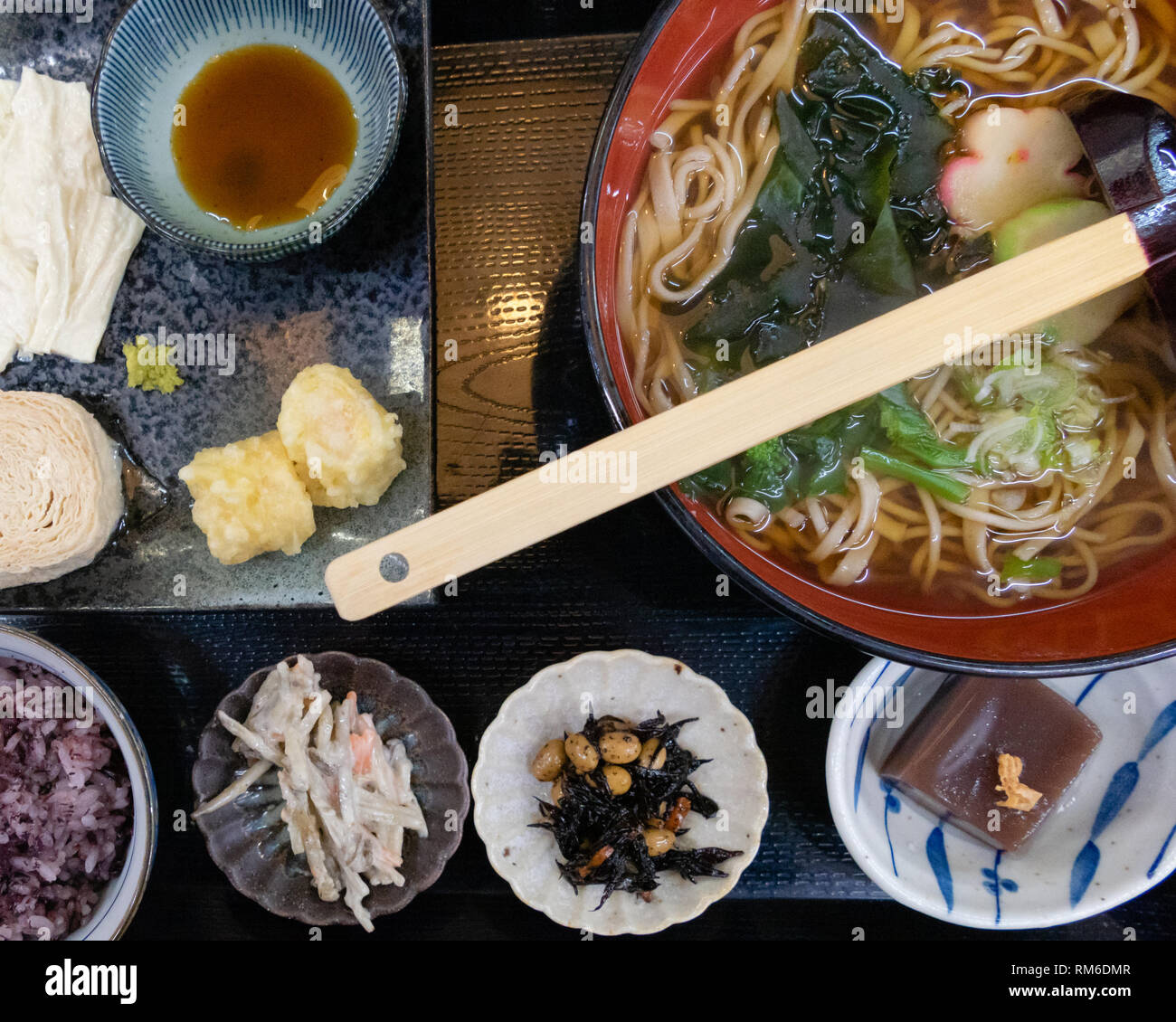 Udon wheat noodles with hot soup, roll soy milk skin, and tempura Stock