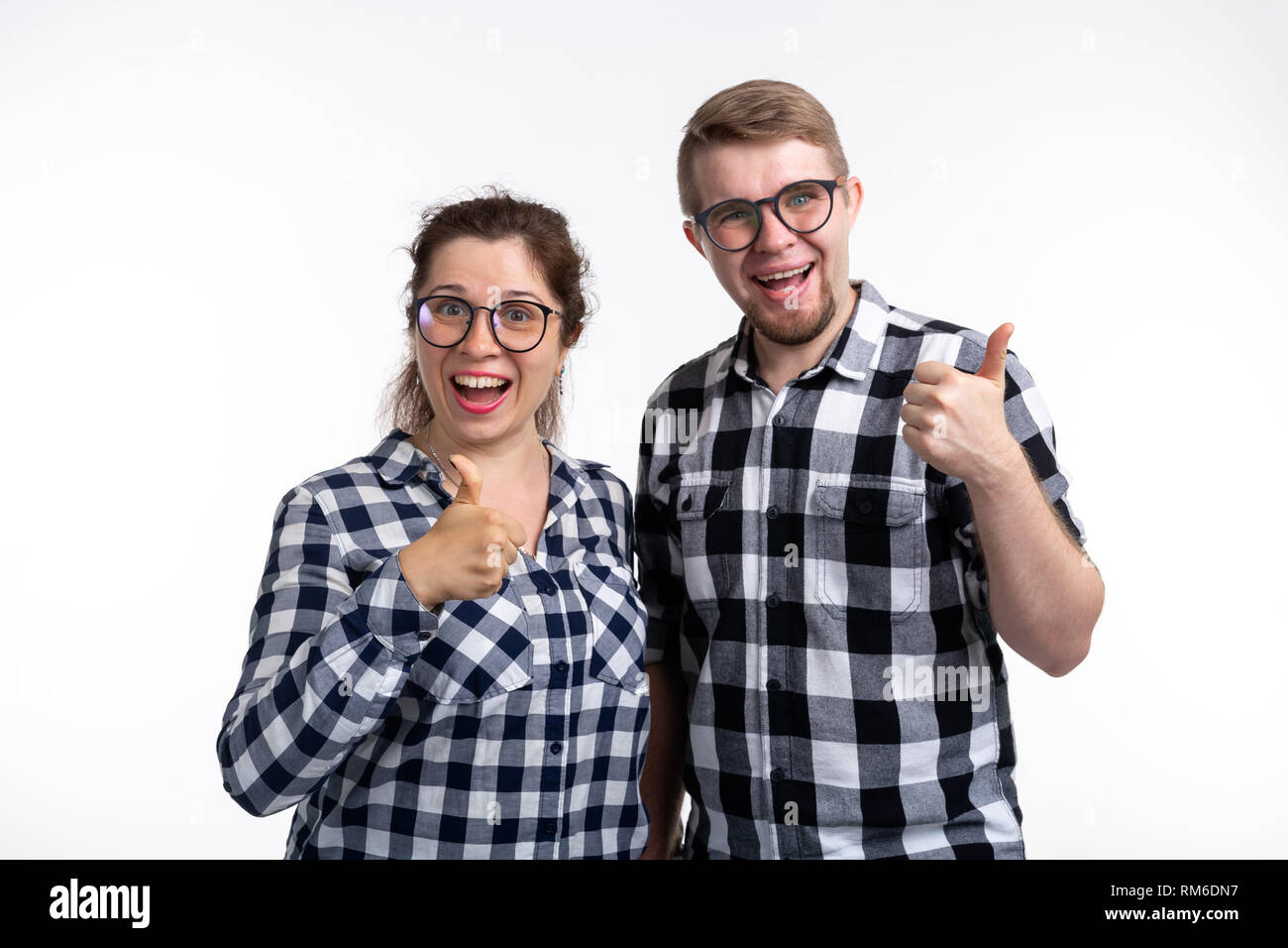 Nerds, geek, bespectacled and funny people concept a couple of nerds