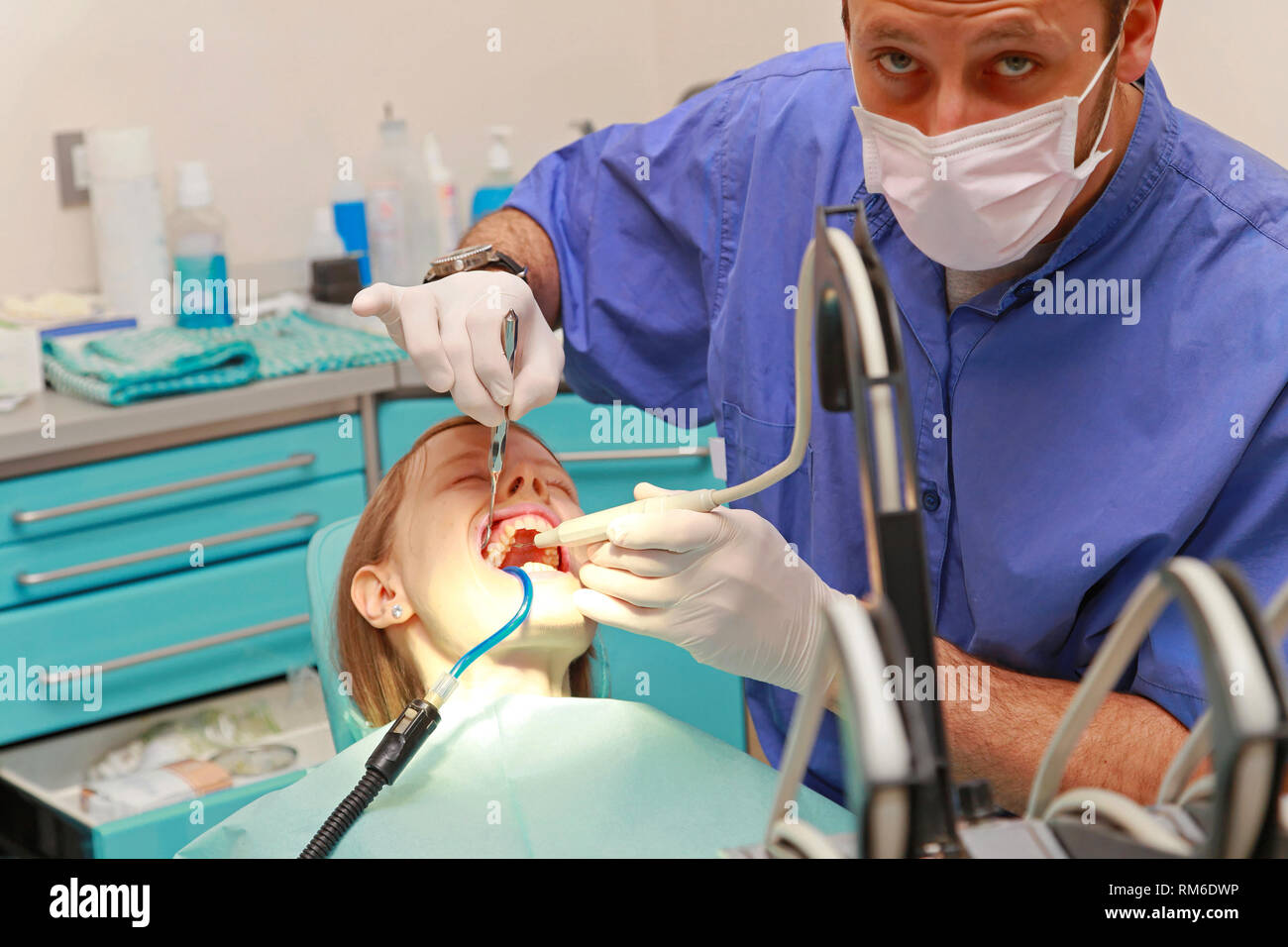 Dentist doctor drilling tooth in dental clinic Stock Photo Alamy