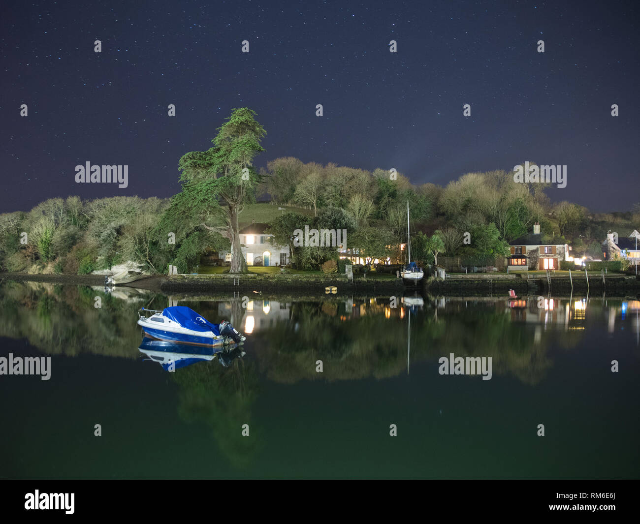 A late night photograph of the stars over the estuary in Kingsbridge, South Devon. Stock Photo