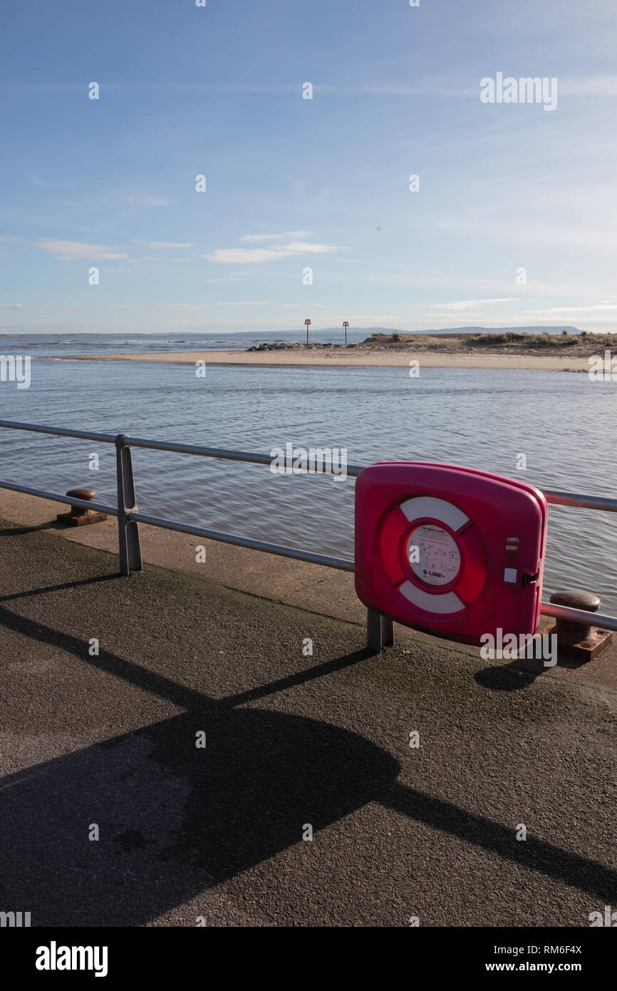 Life ring on railings at the seaside Stock Photo