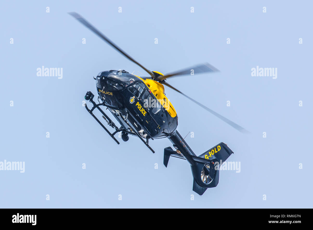 National Police Air Service Helicopter G-POLD searching above Armley in Leeds. Stock Photo