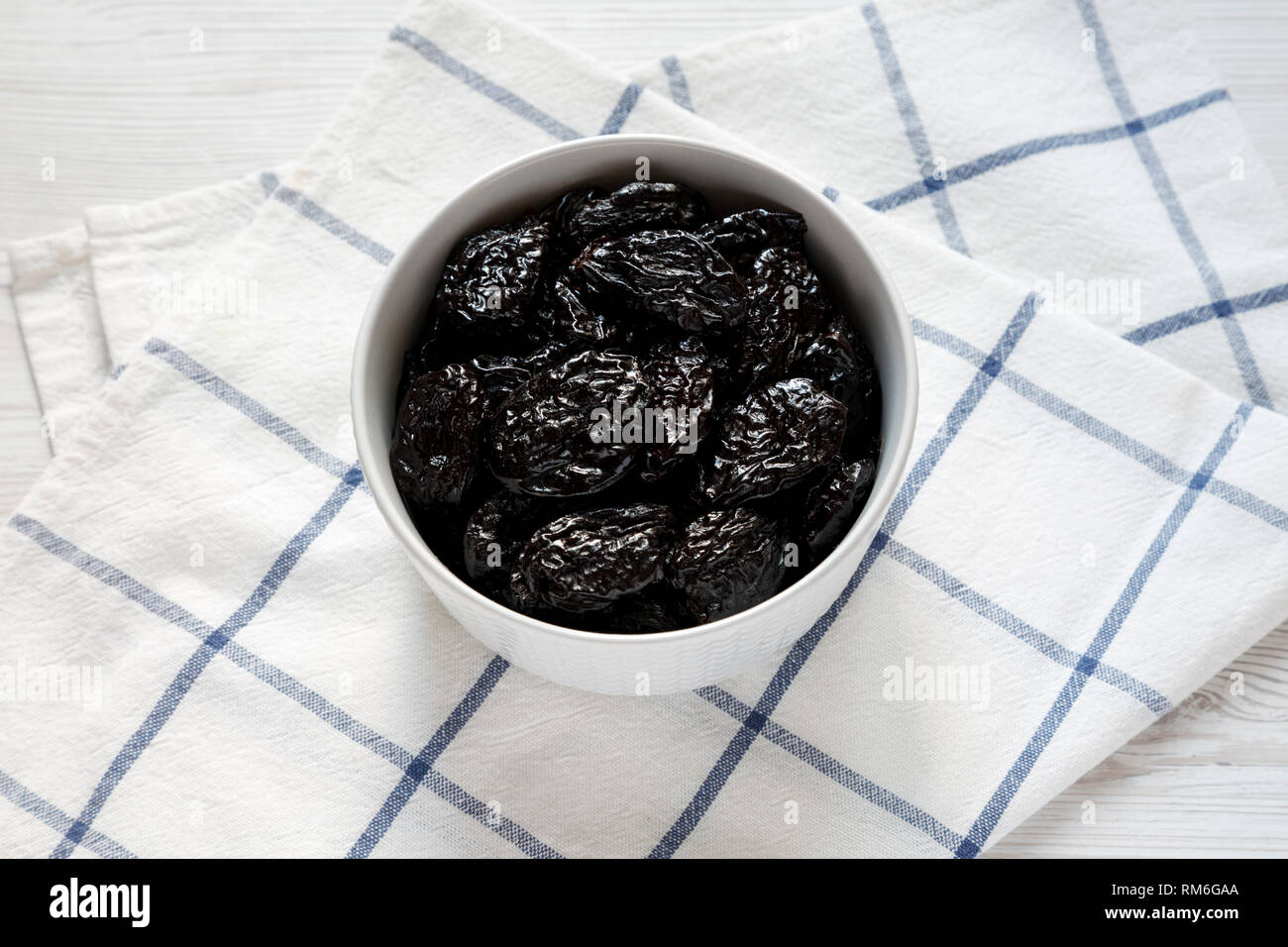 Dry prunes in a bowl, low angle view. Closeup Stock Photo Alamy