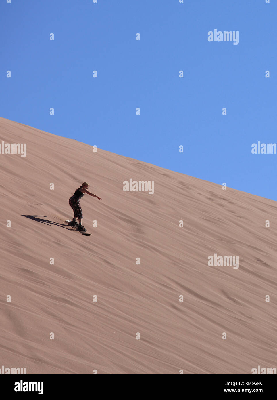 Chile, Antofagasta Region, Atacama Desert, Valle de Marte; Valle de la Muerte, sandboarding, Stock Photo