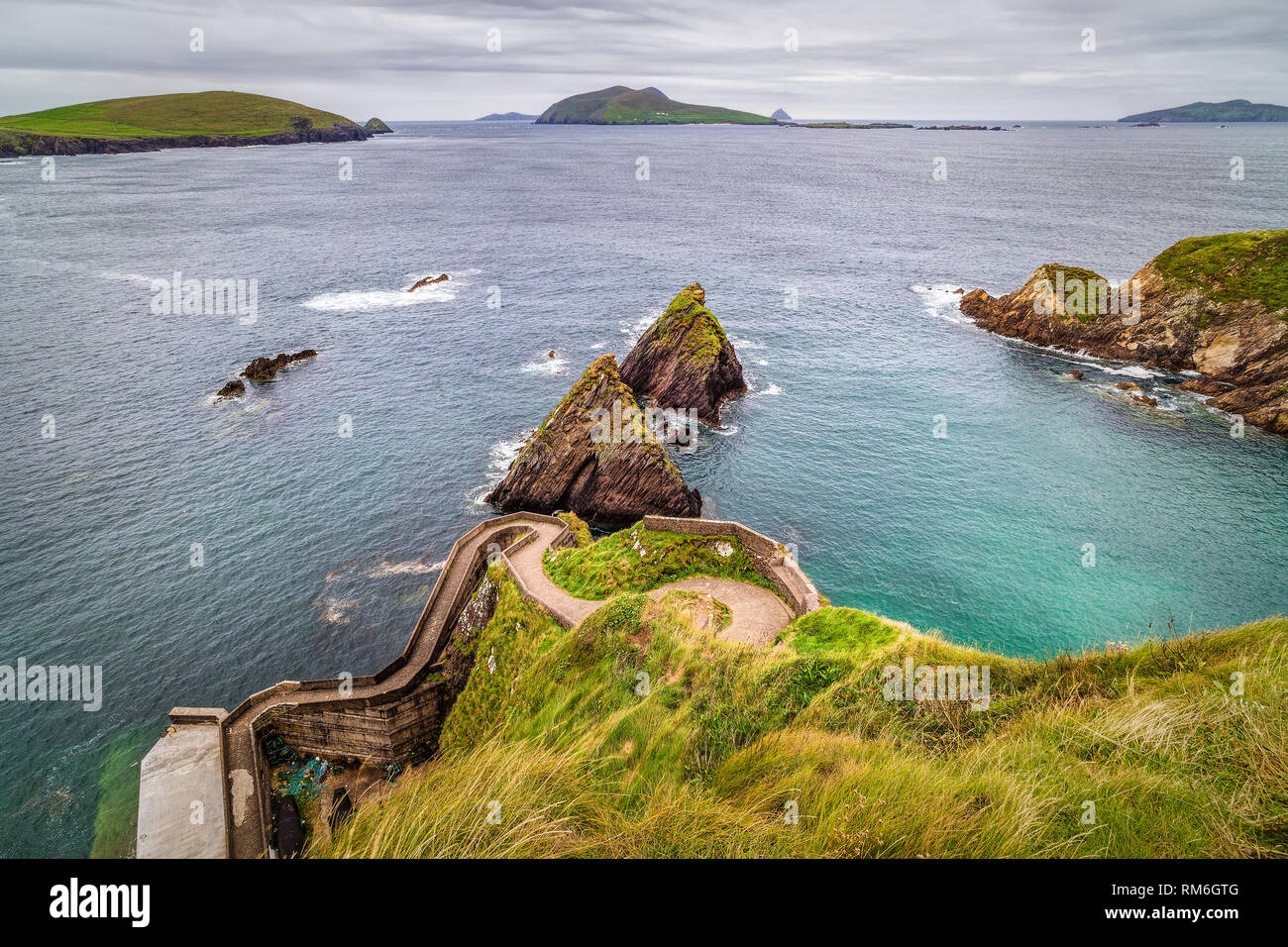 View from high cliff on stairs leading to small harbor and beautiful