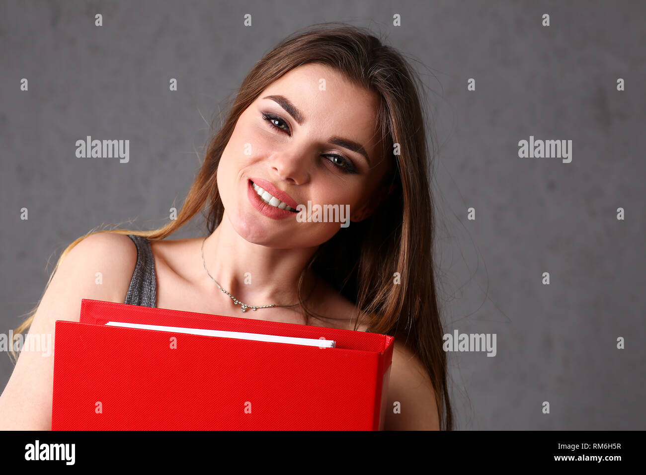 woman holding folder in hand Stock Photo