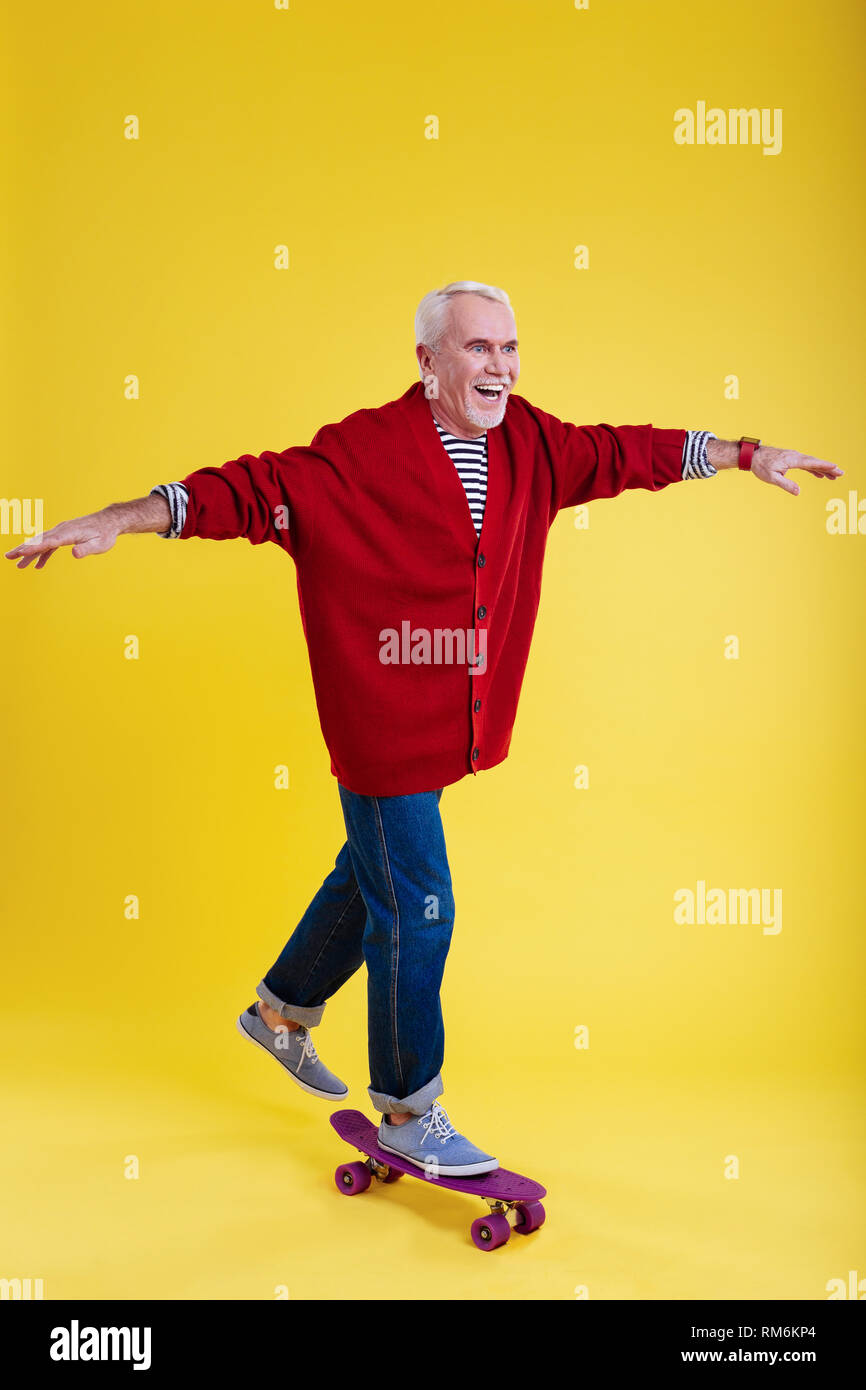 Old man wearing blue jeans hi-res stock photography and images - Alamy