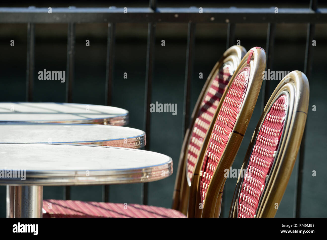 Red and gold chairs and tables outside a restaurant, Canary Wharf, London, United Kingdom Stock Photo