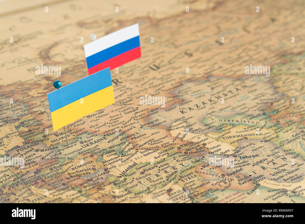 Flags of the Russia and Ukraine on the world map. Conceptual photo, politics and world order, political differences Stock Photo