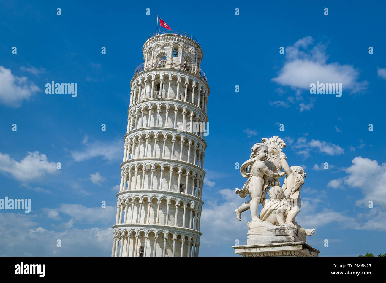 Famous Pisa Tower and Putti Fountain sculpture. Toscana travel attractions, Italy. Stock Photo