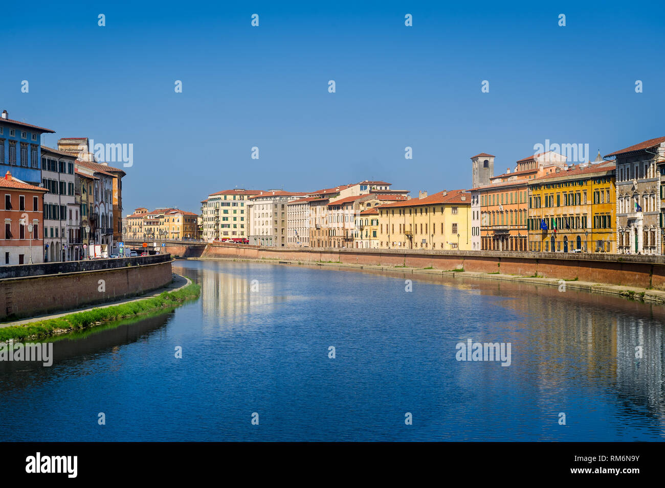 Calm waters of Arno river in the center of Pisa. Toscana province, Italy. Stock Photo