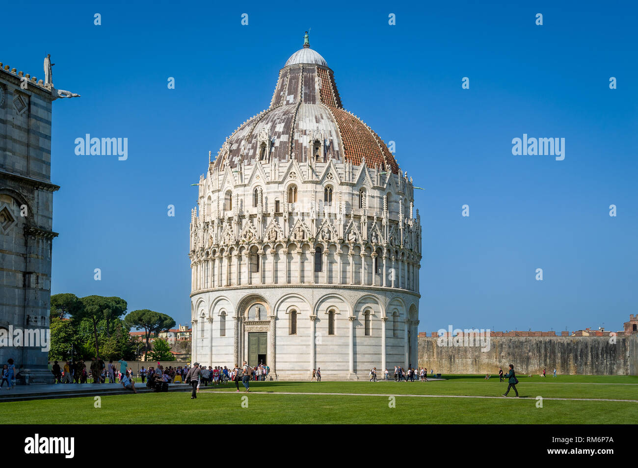 Tourists are visiting Pisa Baptistery and Duomo di Pisa landmarks. Toscana, Italy Stock Photo