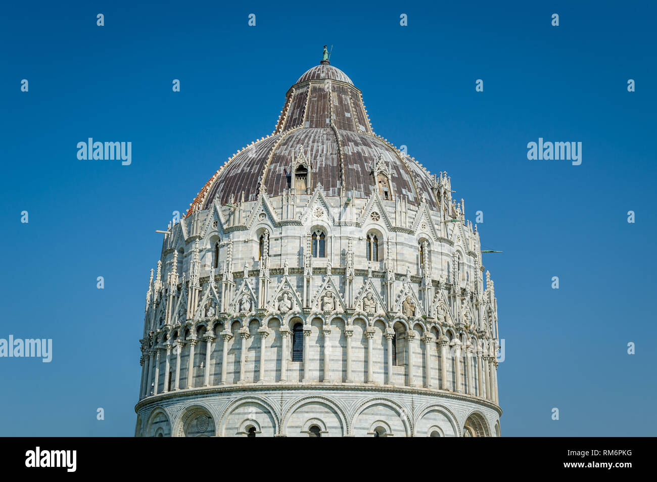Pisa Baptistery decoration close view with blue sky background. Toscana, Italy Stock Photo