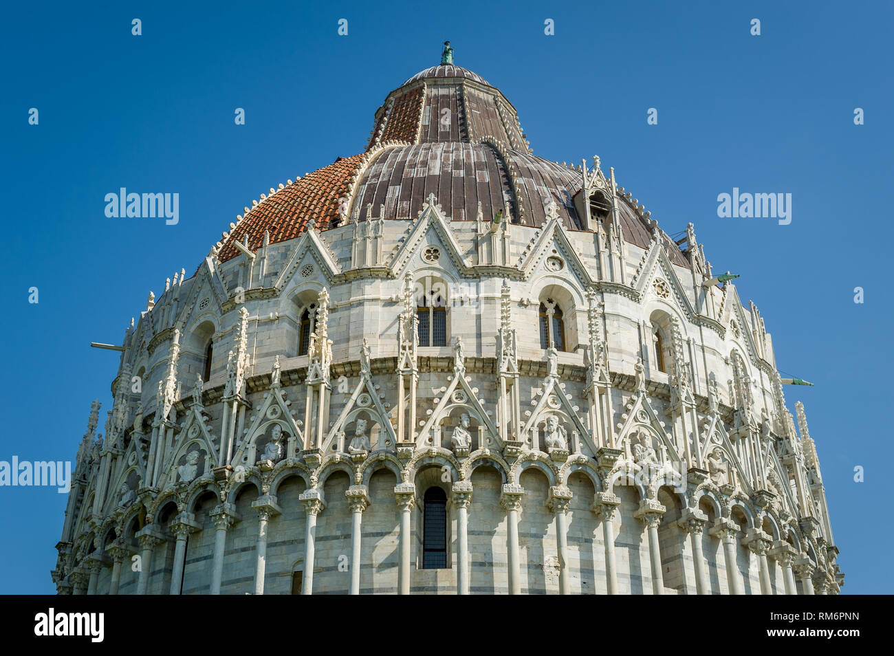 Pisa Baptistery historic tower upper sections close view. Toscana region, Italy Stock Photo