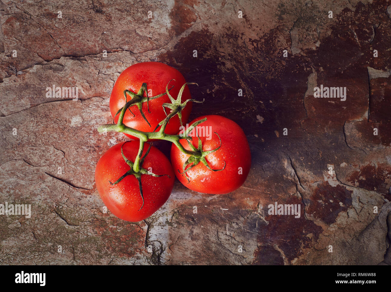 Cherry tomatoes on stone background Stock Photo