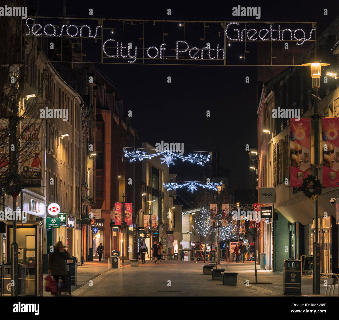 Shoppers in the High Street at dusk in Perth, Scotland, UK Stock Photo