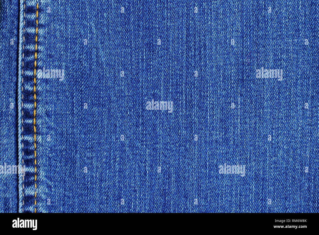 Blue denim jeans background. Fabric, texture backdrop for design purposes. Stock Photo