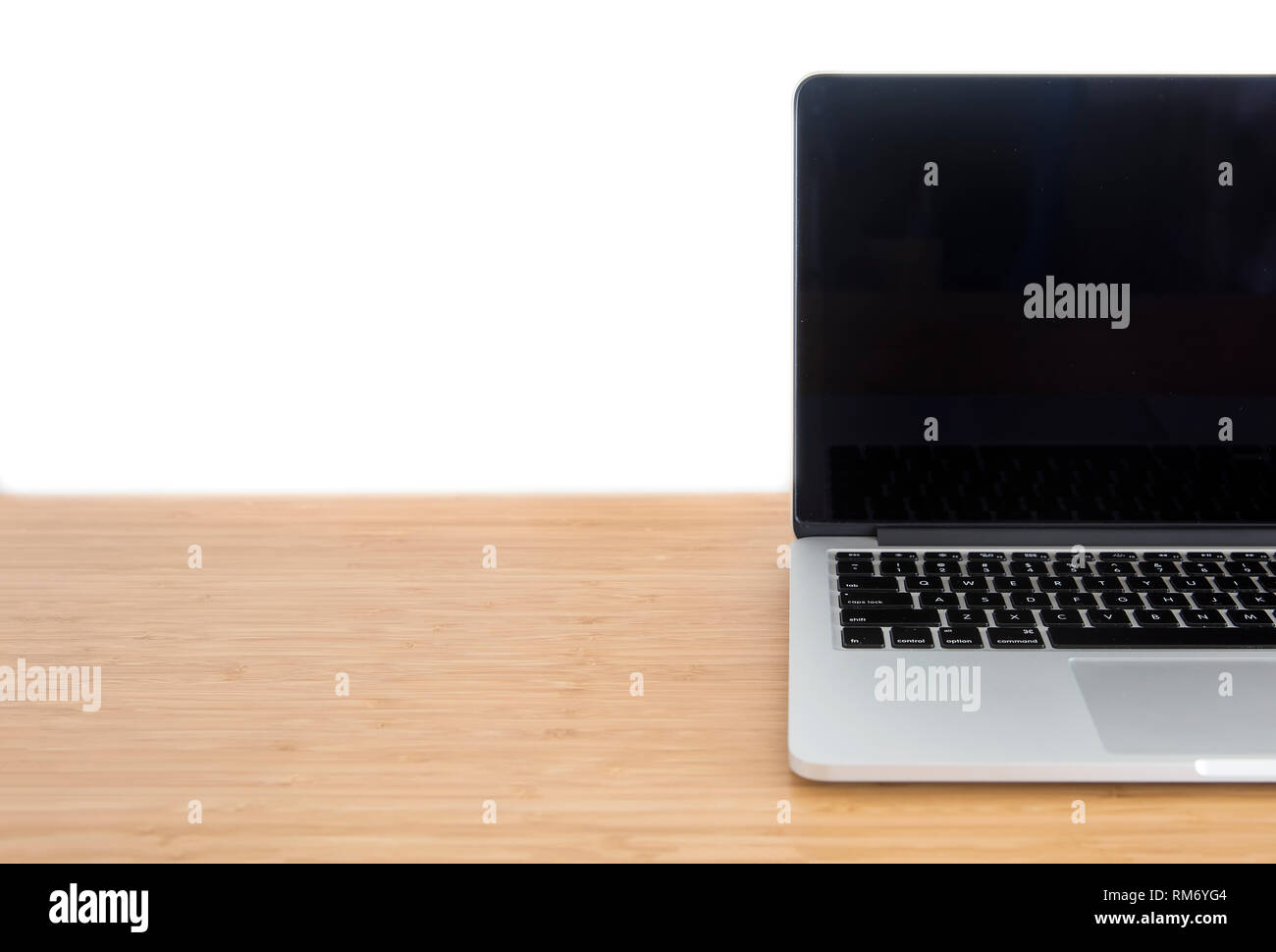 Laptop blank screen on wooden table isolated on white background Stock ...