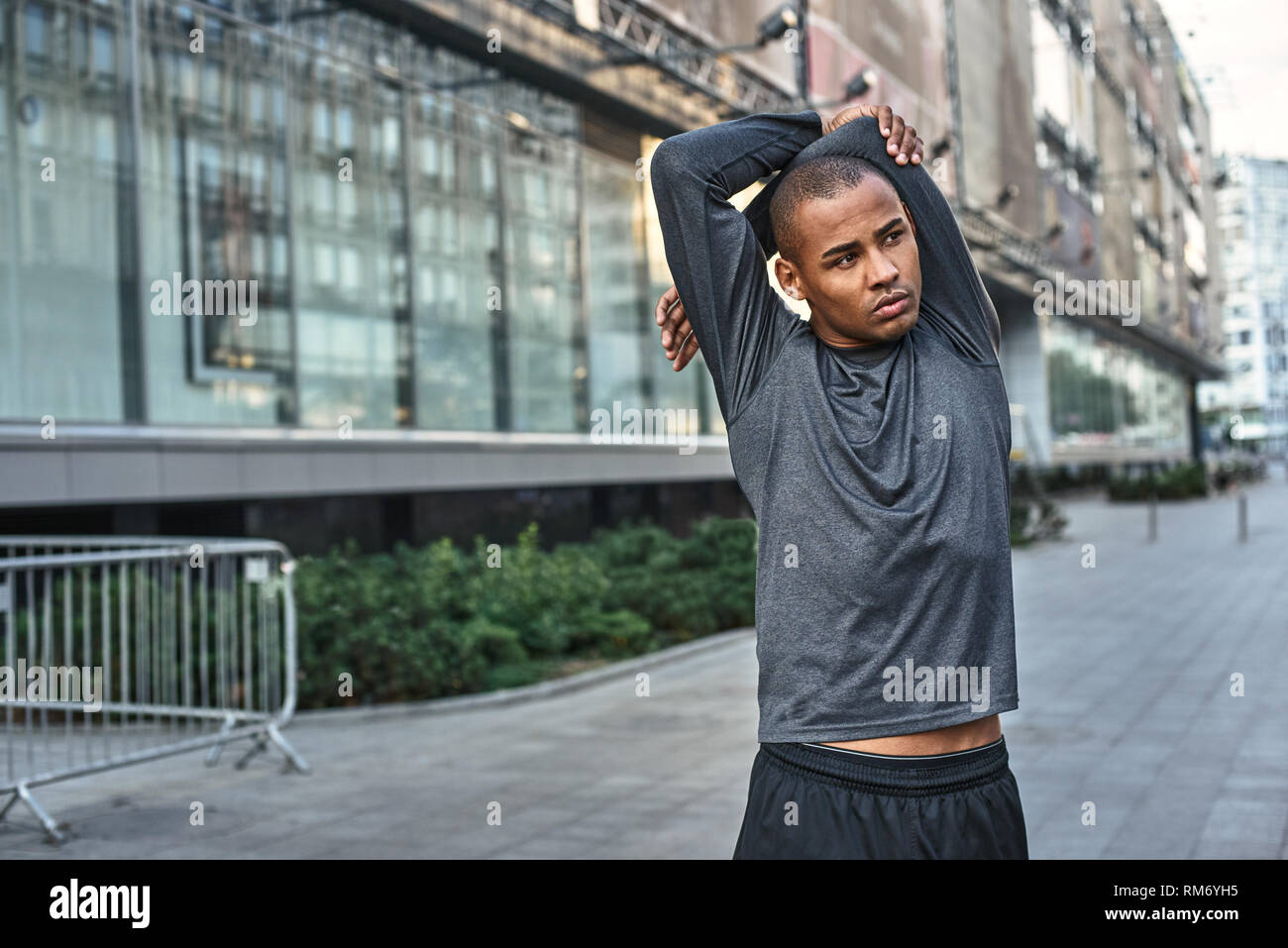 Man stretching arms african hi-res stock photography and images - Alamy