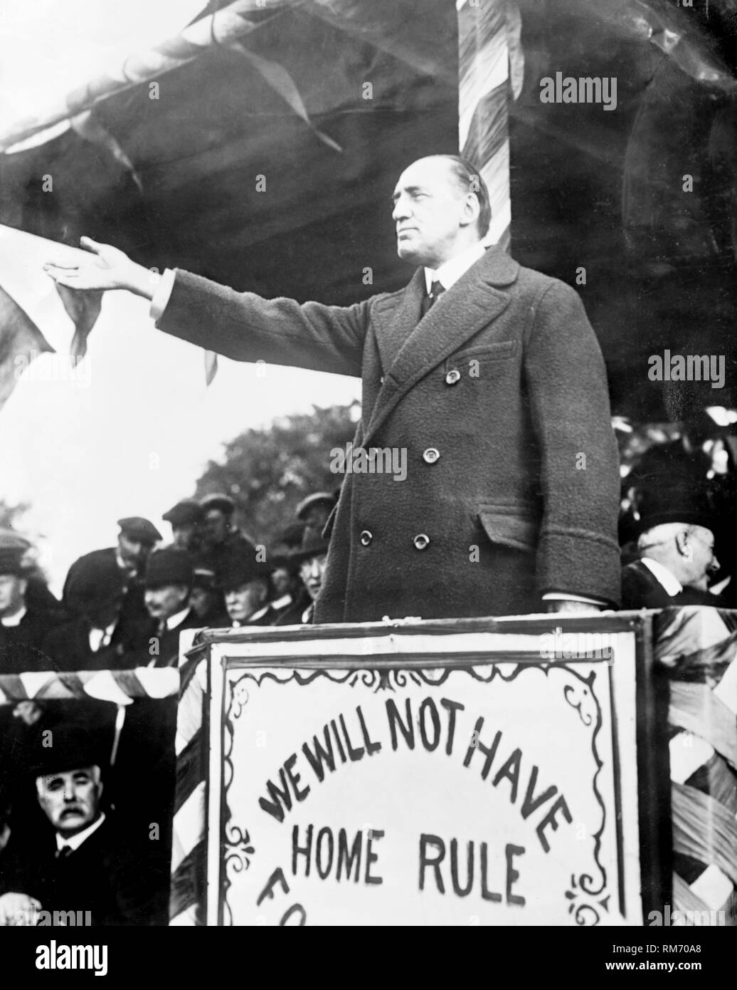 Sir Edward Carson leader of the Irish Unionist Party addresses the Ulster Volunteers militia in Belfast during the home rule crisis in 1914. The ulster volunteers were a paramilitary group formed by ulster protestants to fight home rule in Ireland when the first world war broke out and they formed the ulster volunteer 36th ulster division of the British Army. Stock Photo