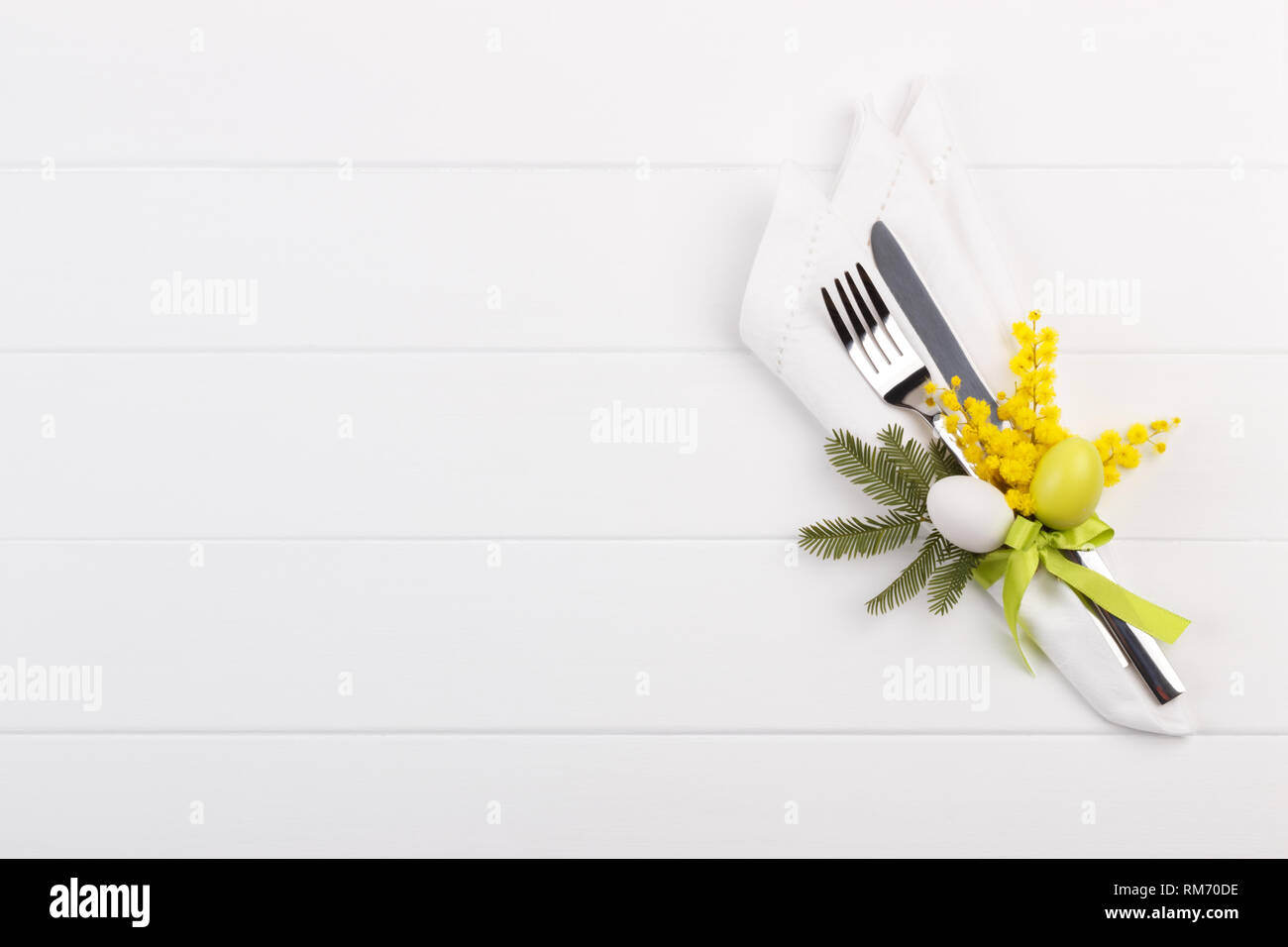 Spring table setting with mimosa easter holidays dinner Stock Photo