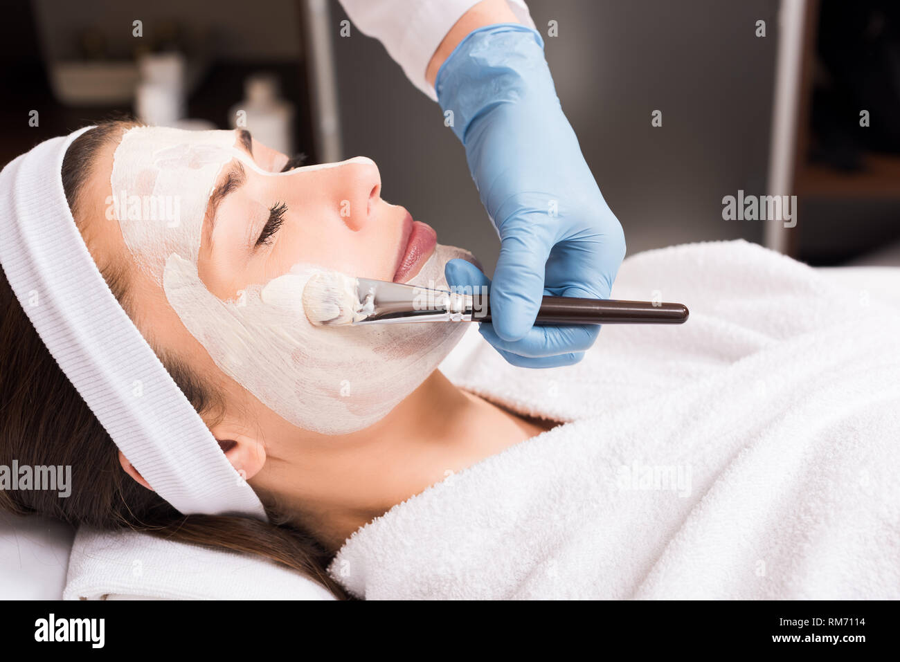 Beautician applying body mask hi-res stock photography and images - Alamy