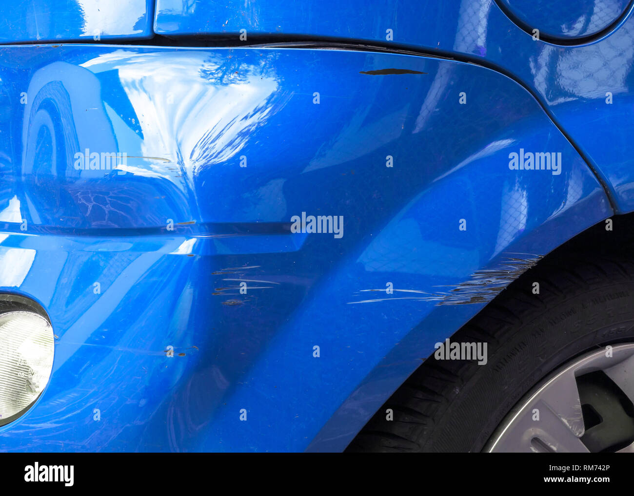 Scratches and dent on the car. Close-up. Stock Photo