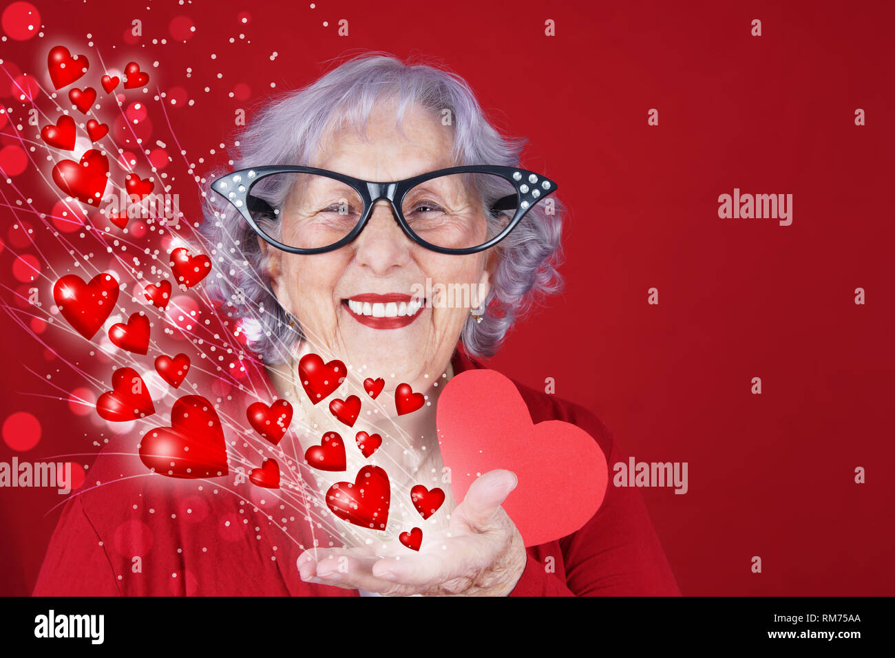 Comical cupid grandma Valentine's or love card with hearts and bokeh Stock Photo