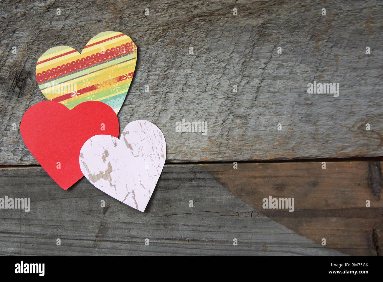 Heart shapes on barn wood background, Valentine's day concept Stock Photo